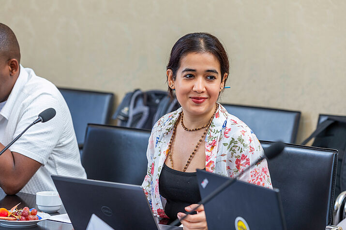 Participant smiling during the negotiation simulation game.